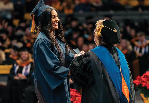 Graceland President Pat Draves congratulates a graduate