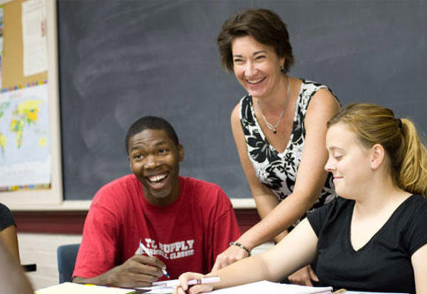 Professor of Accounting, Linda DeBarthe teaching a male and female student