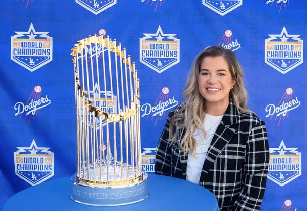 Graceland Graduate Zoe Harmon poses with the World Series trophy