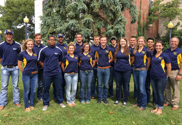 A group of agricultural business students and their professor, Max Pitt