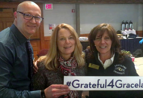 Joe Booz ’86, Michele Black ’81 and Holly Caskey ‘81share the #Grateful4Graceland sign