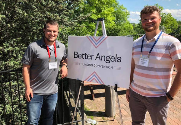 Christian Sarabia and Anthony Ginger pose with a Better Angels sign