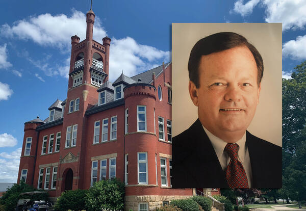 Higdon Administration Building with photo of Joe Hanna