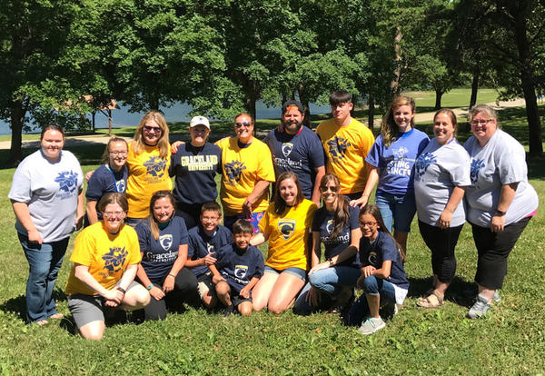 A group of Graceland alumni, staff, students and future students who volunteered at Camp MOJA