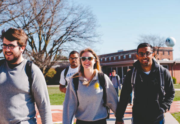 Male and female students walking the Graceland University campus in Lamoni