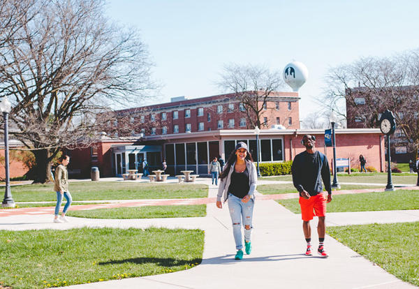 Female and male student walking the Lamoni campus between classes