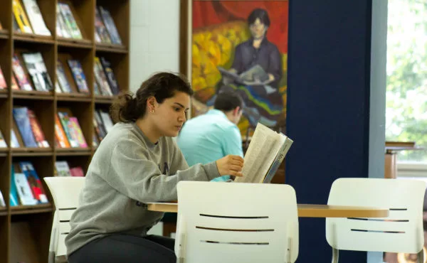 student studying in library