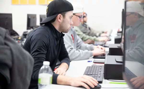 closeup of students using computers in lab