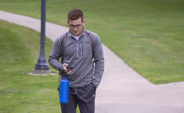 student looking at his phone