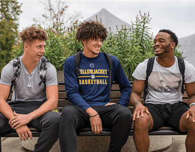 Students sitting together outside