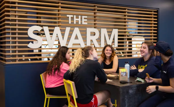 students eating in university restaurant