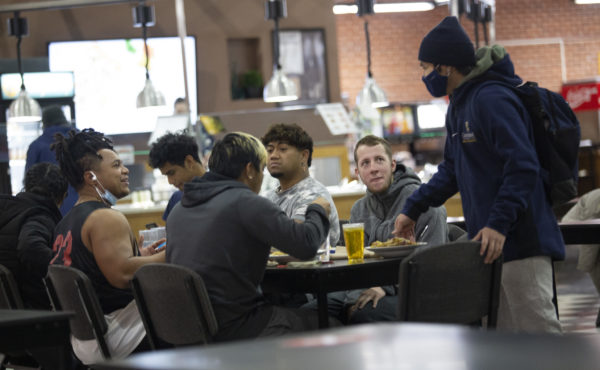 Group of male college students in dining hall