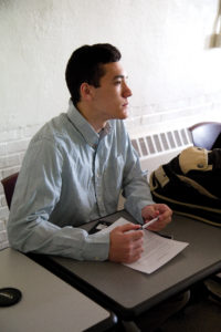 closeup of student sitting at desk in classroom