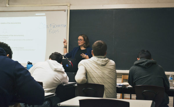 humanities faculty teaches students in classroom