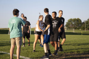 students participate in intramurals outside on campus