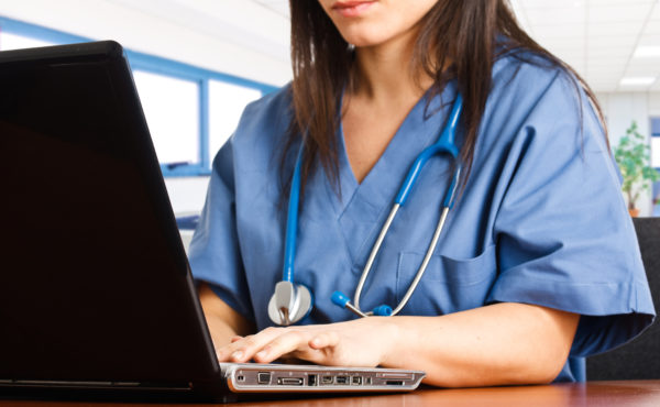 online nursing student working on computer