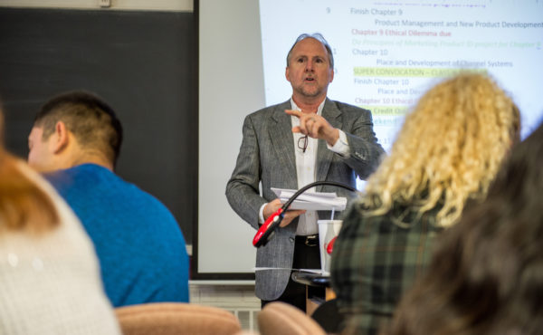 business faculty teaches classroom full of students