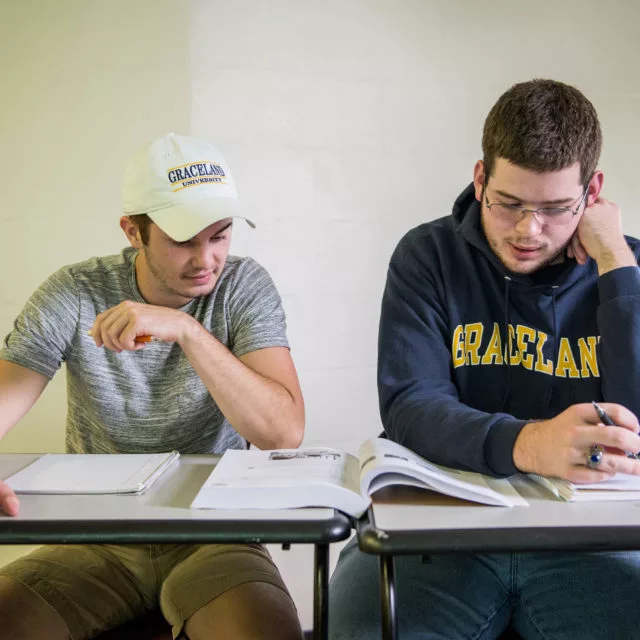 students studying together in classroom