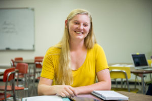 closeup of smiling student in classroom