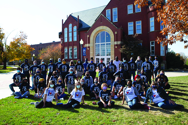 Group of students in matching shirts on college quad