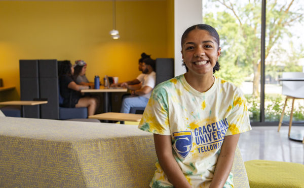 Paris Anderson female student smiles in student union
