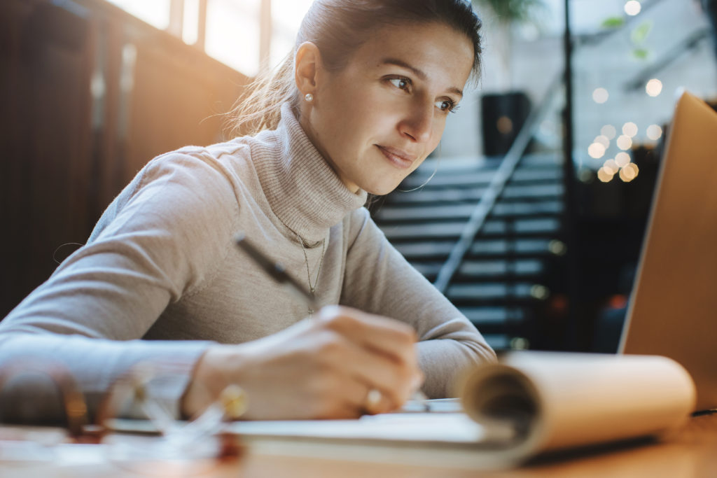 Online female student working on laptop