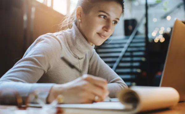 Online female student working on laptop