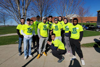 A group of volunteers from Graceland Men's Basketball pose in their Special Olympics volunteer shirts.