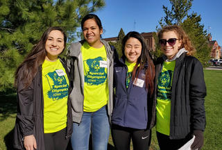 A group of volunteers from Graceland Women's Volleyball pose in their Special Olympics volunteer shirts.