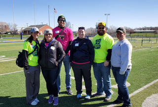 The Graceland Athletic Training staff poses for a photo on the football field after Special Olympics.