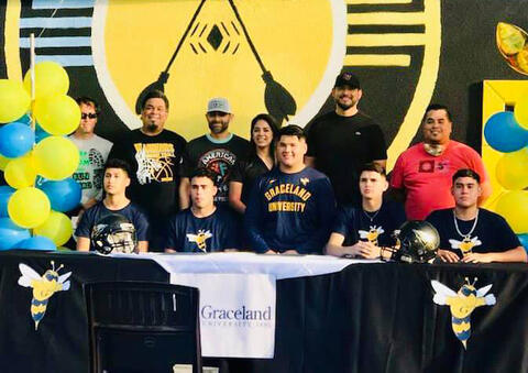 Graceland University alumni pose with five Santa Rosa Graceland football recruits