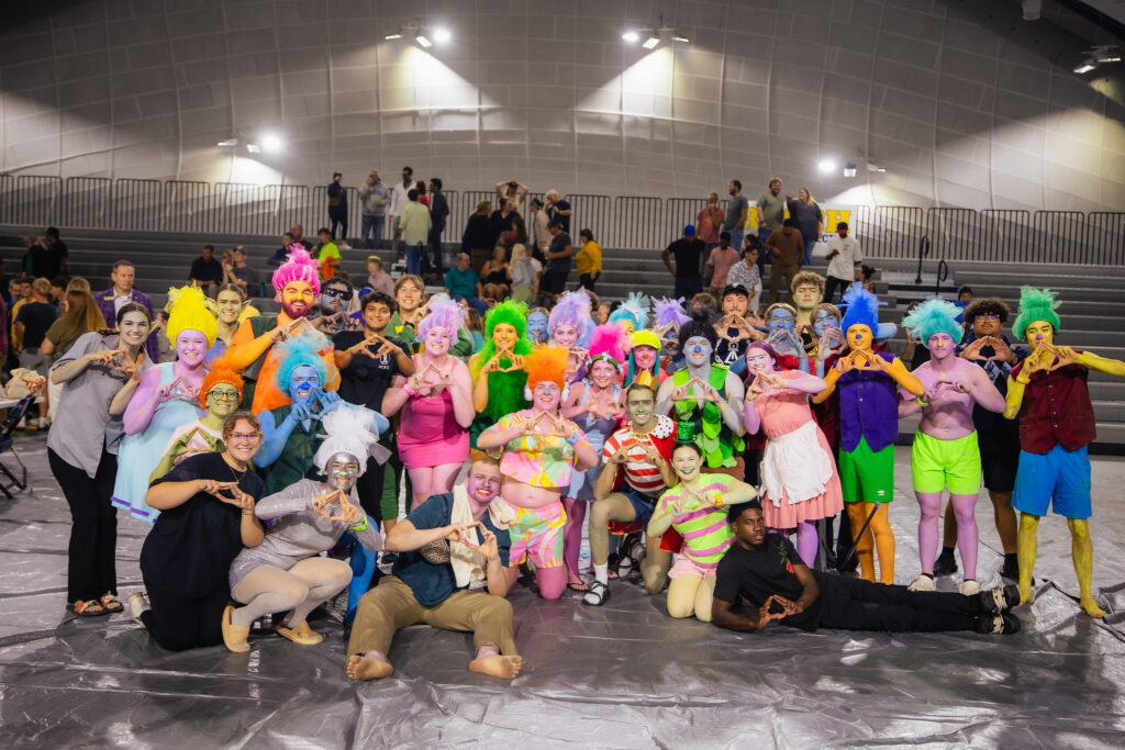 students dressed in costumes celebrating